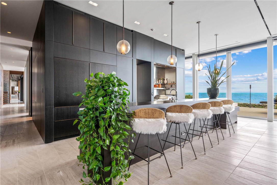 3700 Ocean Drive Vero Beach, FL 32963 - Photo 7 of 36 a view of a dining room with furniture and chandelier