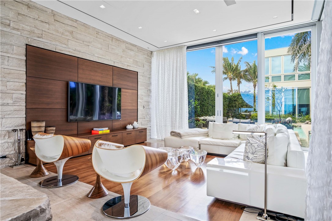 3700 Ocean Drive Vero Beach, FL 32963 - Photo 9 of 36 a living room with furniture and a large window