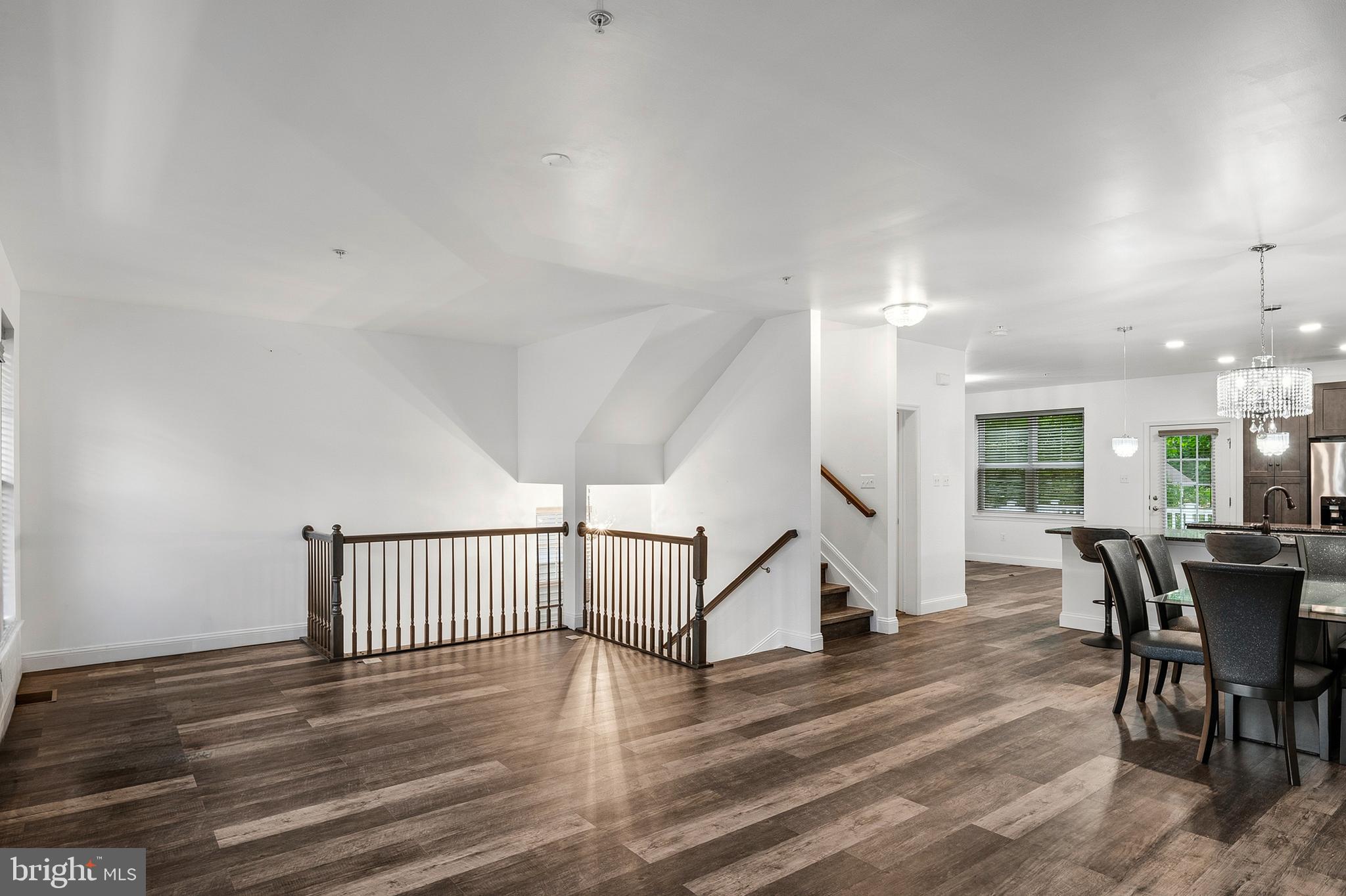 33 Greensborough Road Reisterstown, MD 21136 - Photo 21 of 40 a view of a dining room with furniture wooden floor and a rug