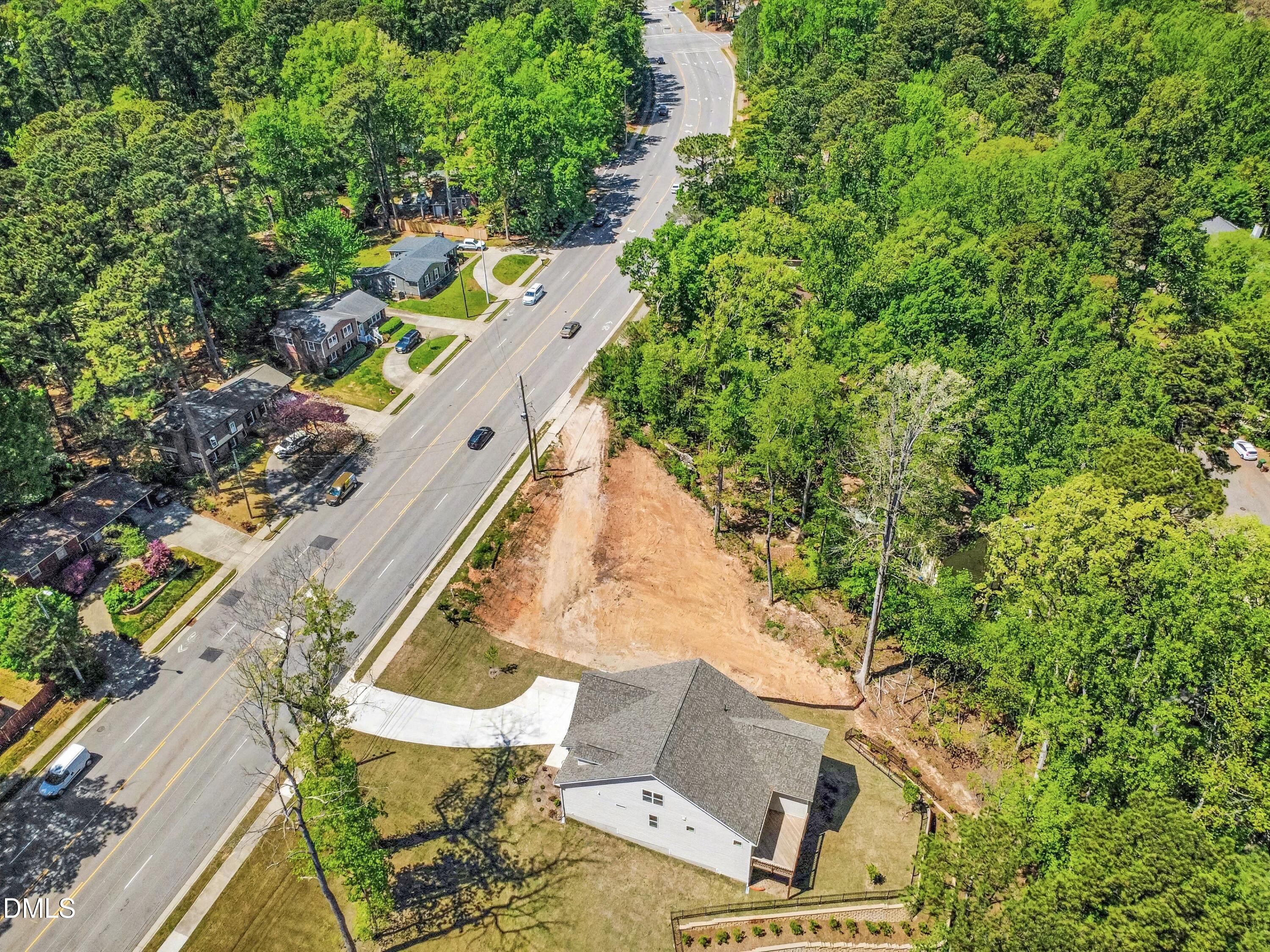 904 Southwest Maynard Road Cary, NC 27511 - Photo 8 of 18 an aerial view of a house with a yard and trees