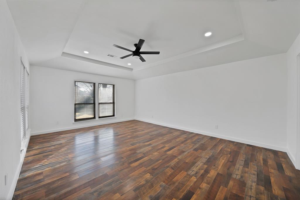 3410 Faulkner Drive Rowlett, TX 75088 - Photo 17 of 38 wooden floor in an empty room with a window