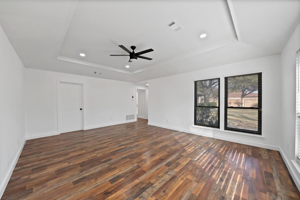 3410 Faulkner Drive Rowlett, TX 75088 - Photo 18 of 38 a view of empty room with wooden floor and fan