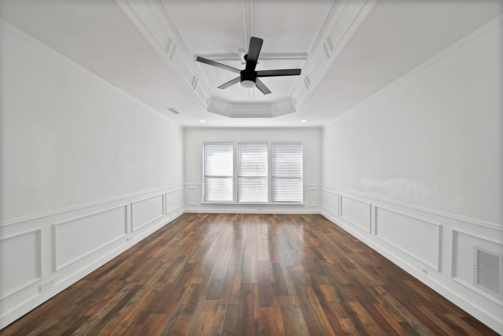 3410 Faulkner Drive Rowlett, TX 75088 - Photo 21 of 38 a view of empty room with wooden floor and fan