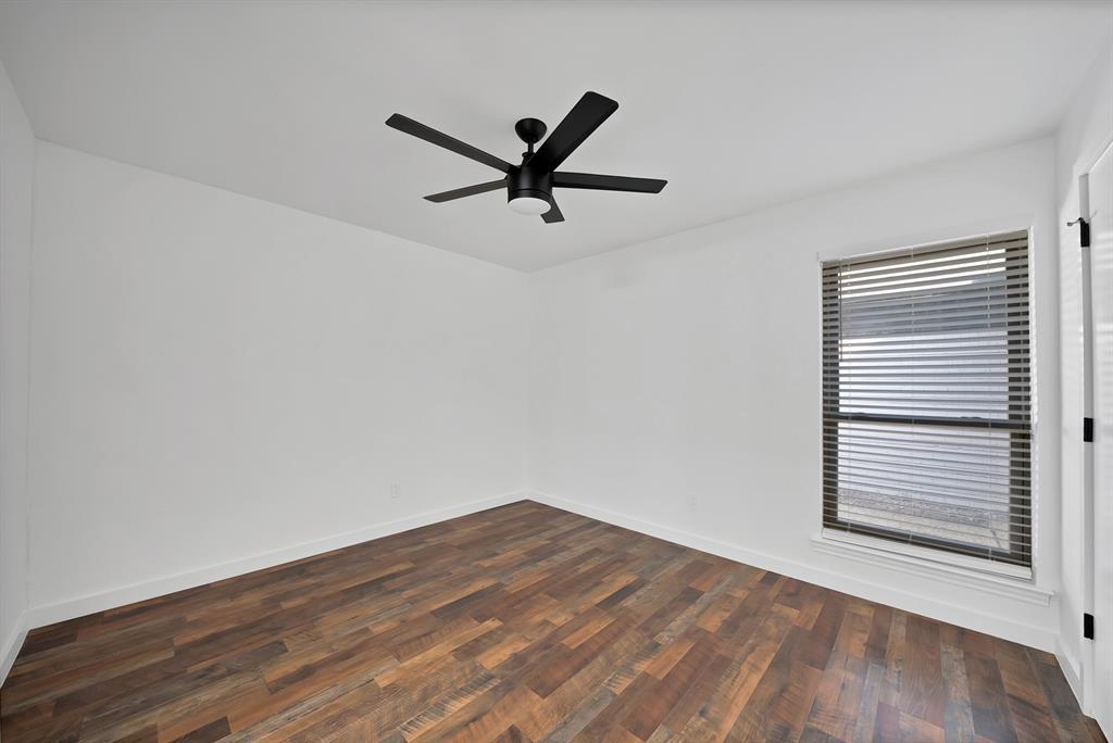 3410 Faulkner Drive Rowlett, TX 75088 - Photo 22 of 38 wooden floor in an empty room with a window