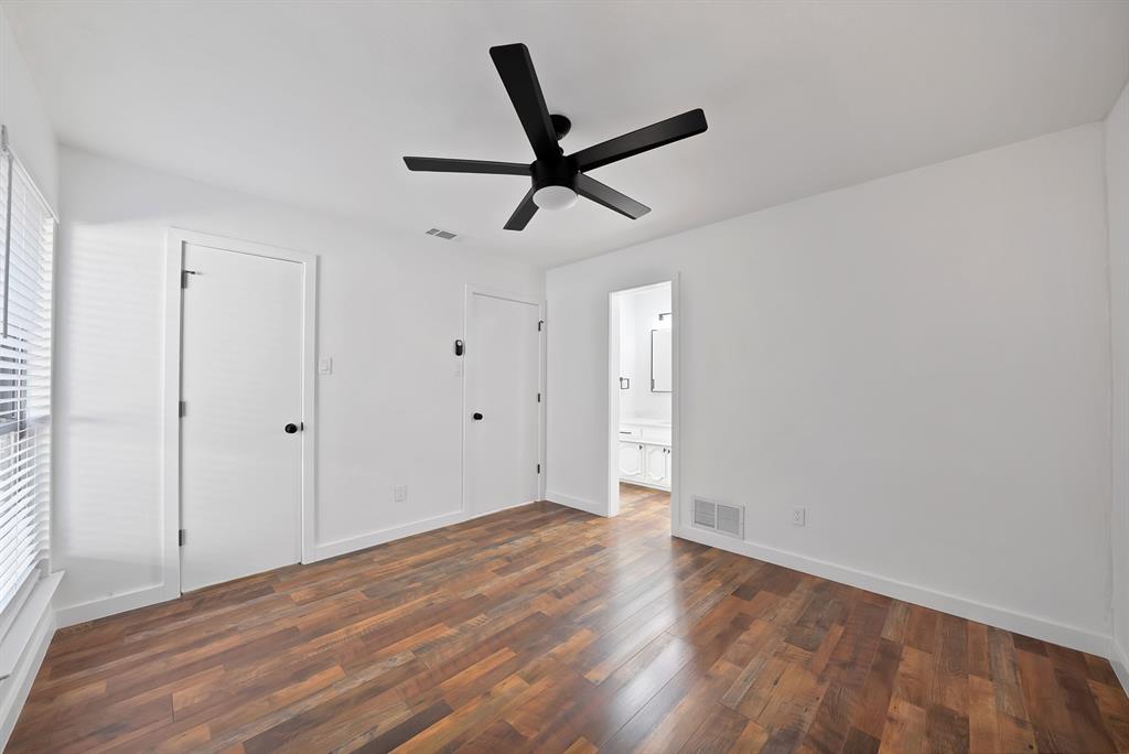 3410 Faulkner Drive Rowlett, TX 75088 - Photo 23 of 38 a view of a livingroom with a ceiling fan and wooden floor
