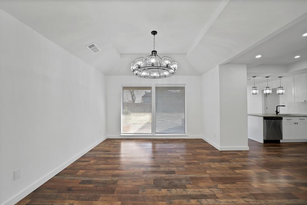 3410 Faulkner Drive Rowlett, TX 75088 - Photo 10 of 38 a view of an empty room with a window and wooden floor