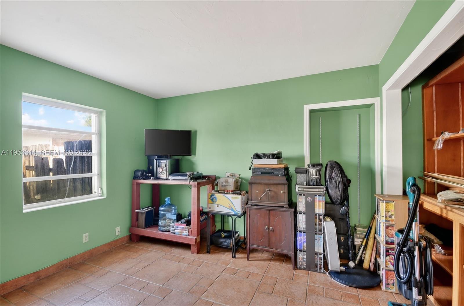 1712 High Ridge Road Lake Worth, FL 33461 - Photo 14 of 43 a room with furniture and a window