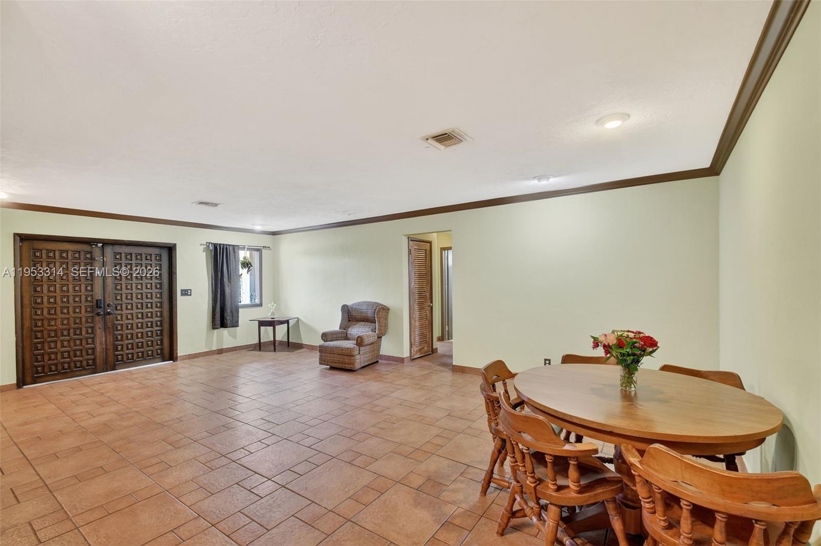 1712 High Ridge Road Lake Worth, FL 33461 - Photo 22 of 43 a living room with furniture and a potted plant