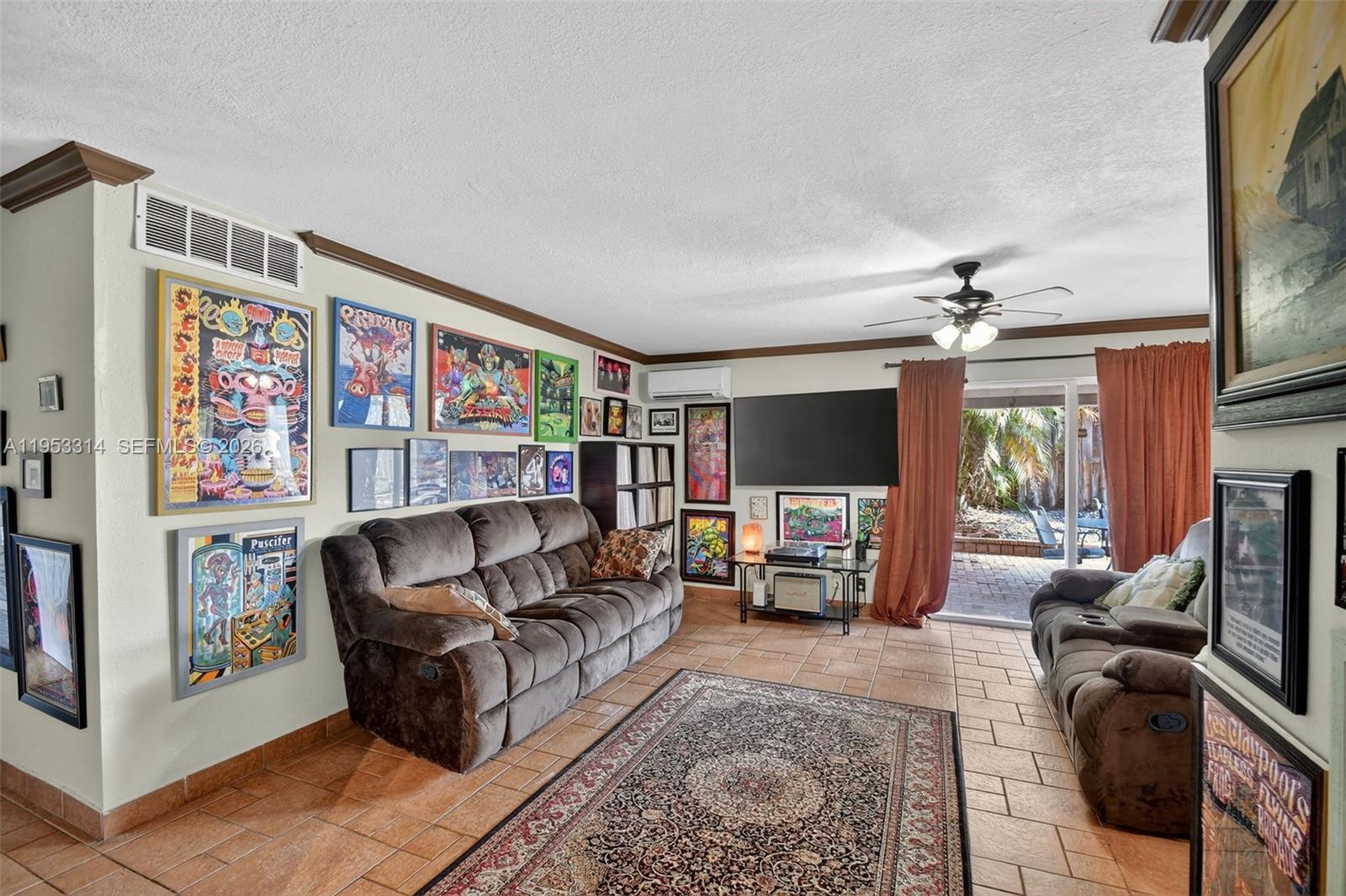 1712 High Ridge Road Lake Worth, FL 33461 - Photo 23 of 43 a living room with furniture and a flat screen tv