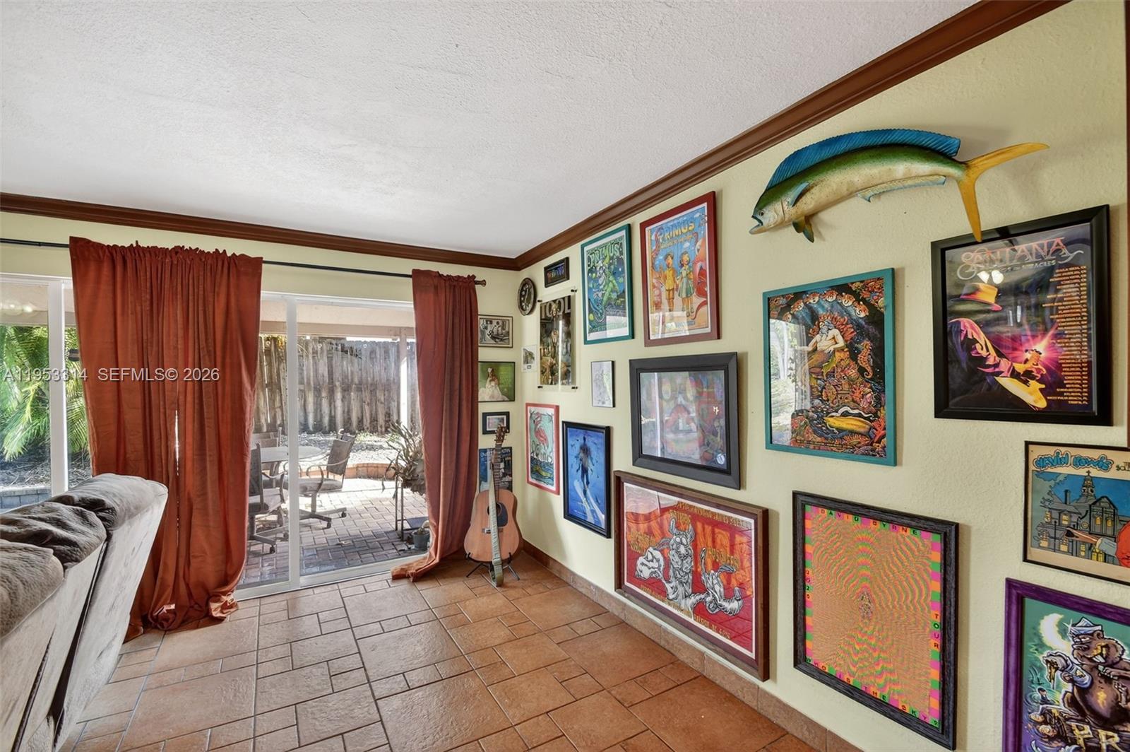 1712 High Ridge Road Lake Worth, FL 33461 - Photo 27 of 43 a view of an entryway with furniture and garden view