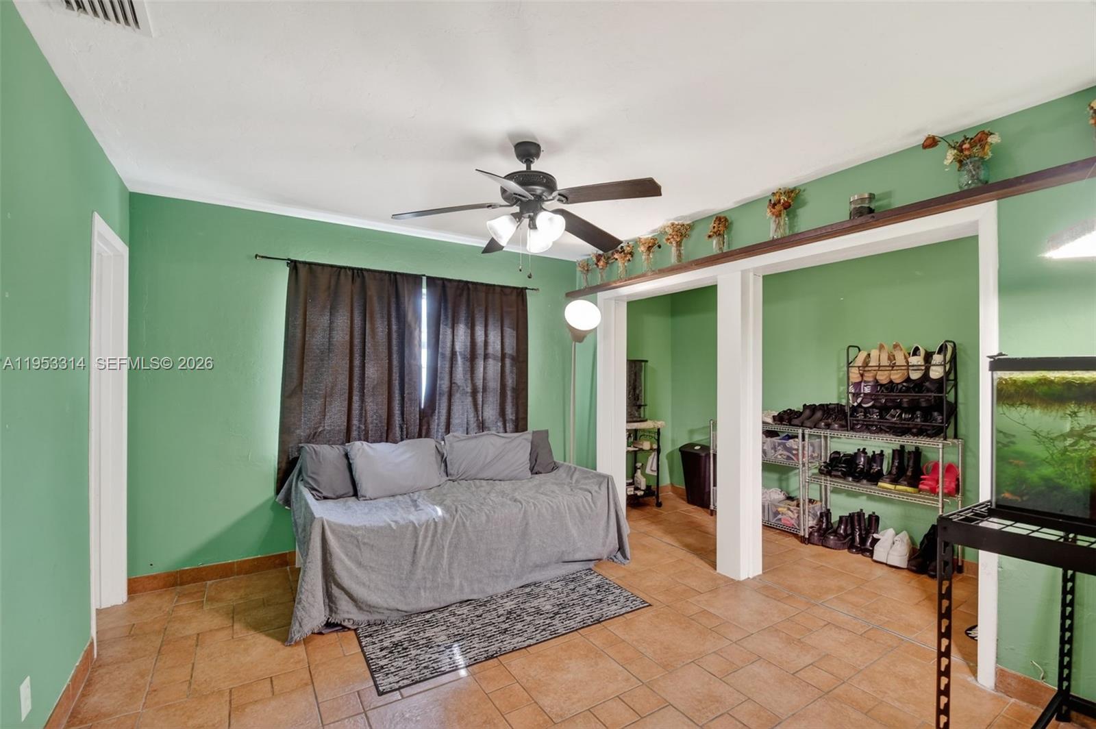 1712 High Ridge Road Lake Worth, FL 33461 - Photo 33 of 43 a living room with furniture and a flat screen tv