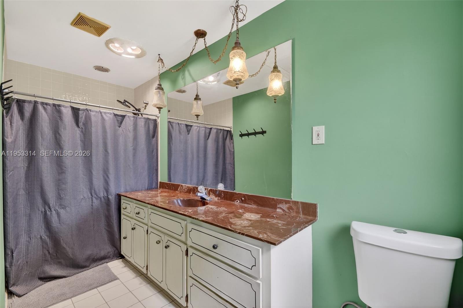 1712 High Ridge Road Lake Worth, FL 33461 - Photo 36 of 43 a bathroom with a granite countertop sink and a mirror