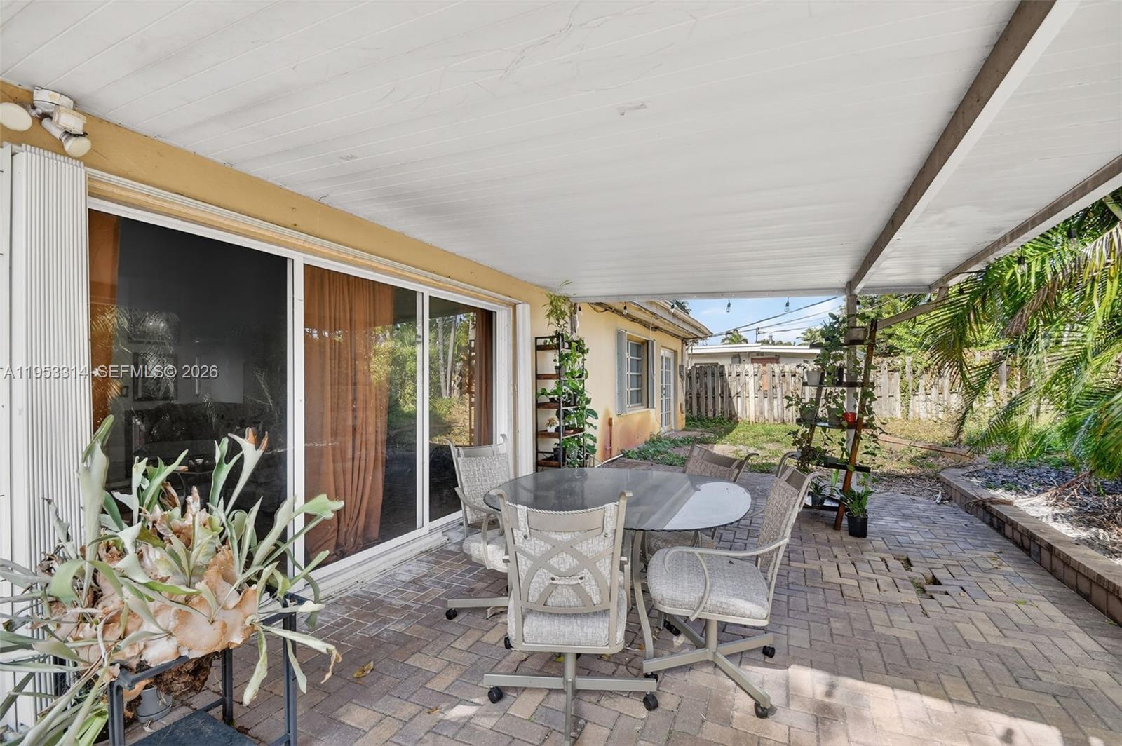 1712 High Ridge Road Lake Worth, FL 33461 - Photo 40 of 43 a dining room with furniture and wooden floor