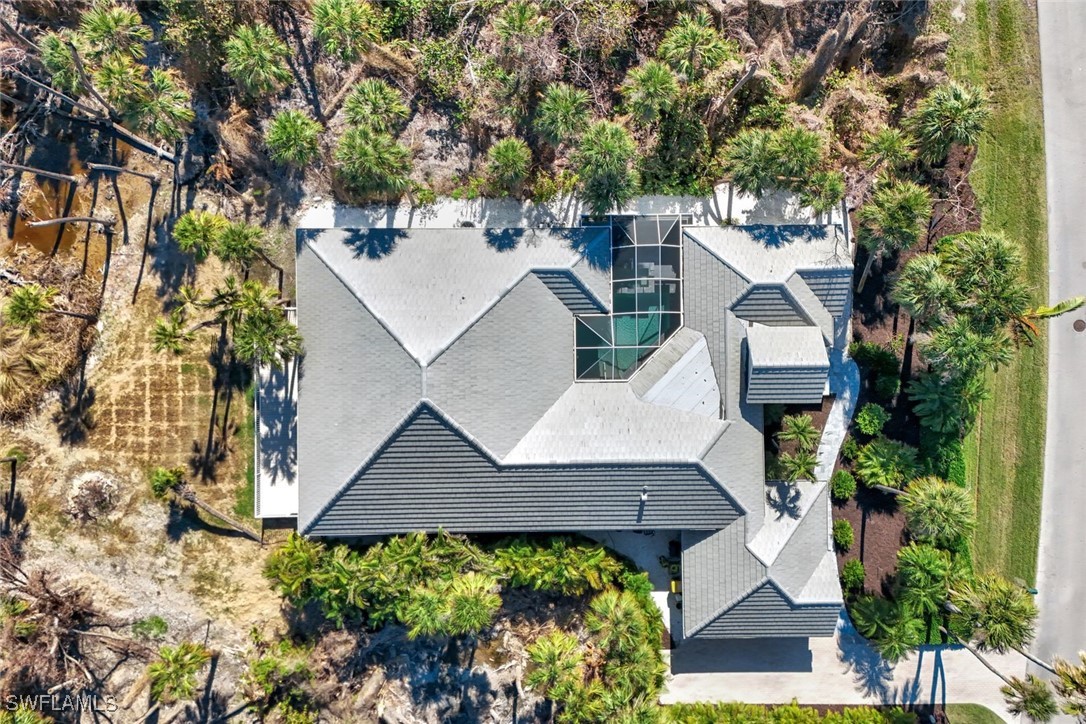 2450 Wulfert Road Sanibel, FL 33957 - Photo 3 of 44 an aerial view of a house with yard