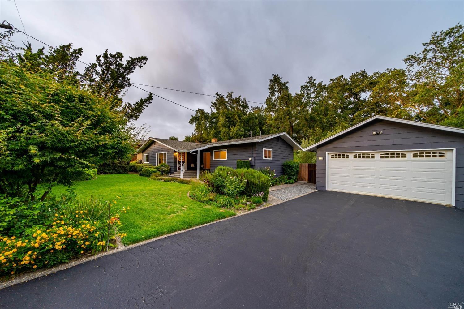 117 East Shiloh Road Santa Rosa, CA 95403 - Photo 1 of 1 a view of a house with a small yard and a large tree