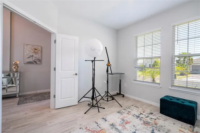 a view of a dining room with furniture window and wooden floor