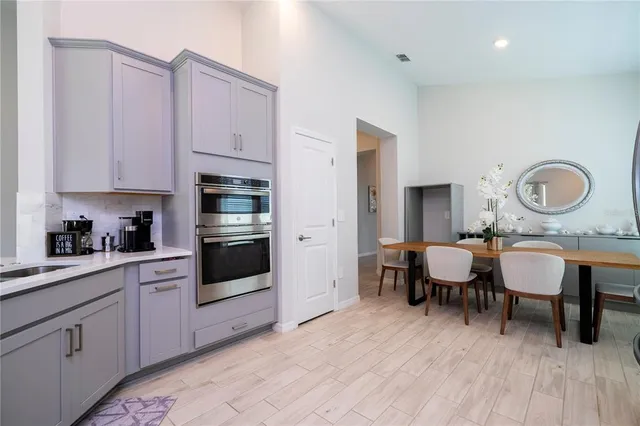 a kitchen with stainless steel appliances a stove top oven and sink