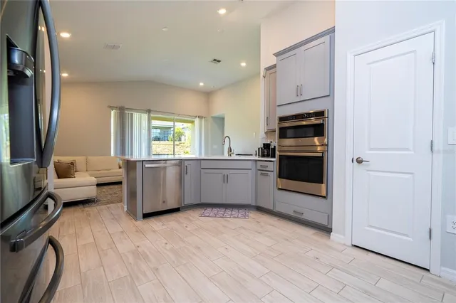 a bedroom with a large bed and a large window