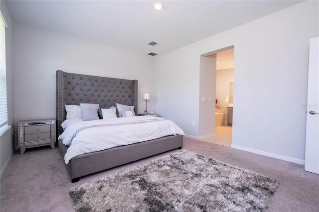 a bathroom with a double vanity sink and mirror