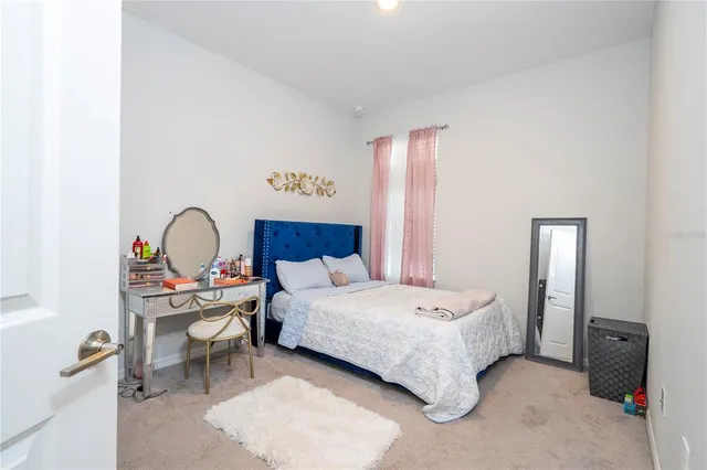 an aerial view of a house with yard swimming pool and outdoor seating