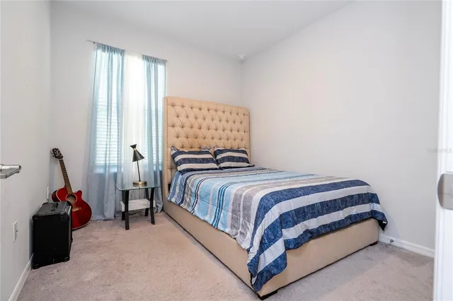 an aerial view of a house with a lake view