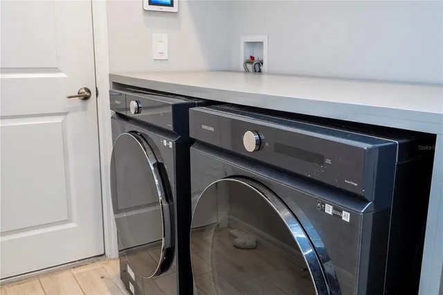 an aerial view of residential houses and outdoor space