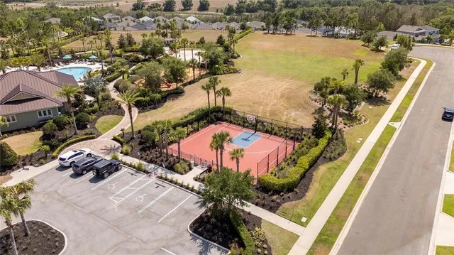 a view of a swimming pool with a yard