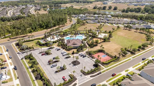 a view of a backyard with plants and patio