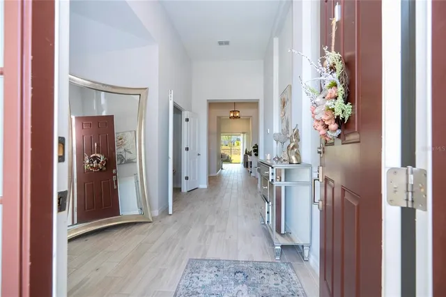 a bathroom with mirror and window