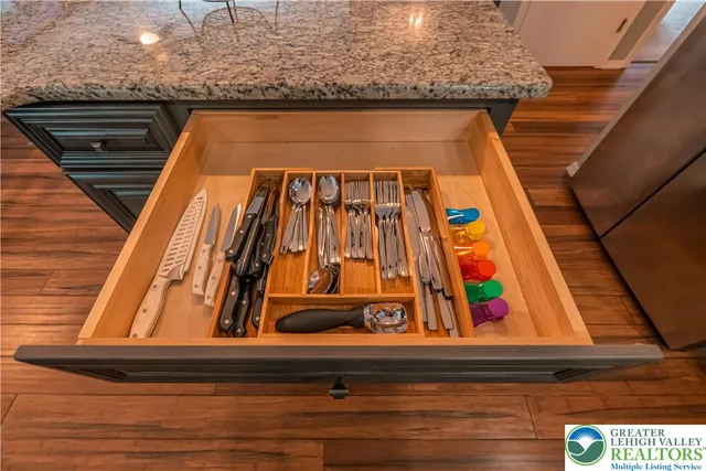 a view of entryway with wooden floor and stairs