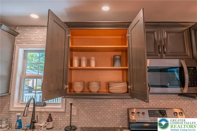 a bathroom with a sink a toilet and a shower