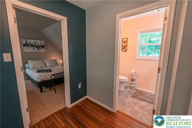 a view of a house with swimming pool and sitting area