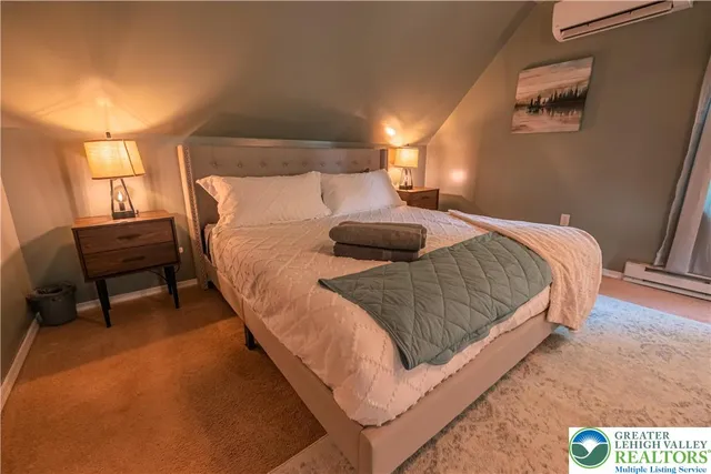 a view of a swimming pool with plants and trees