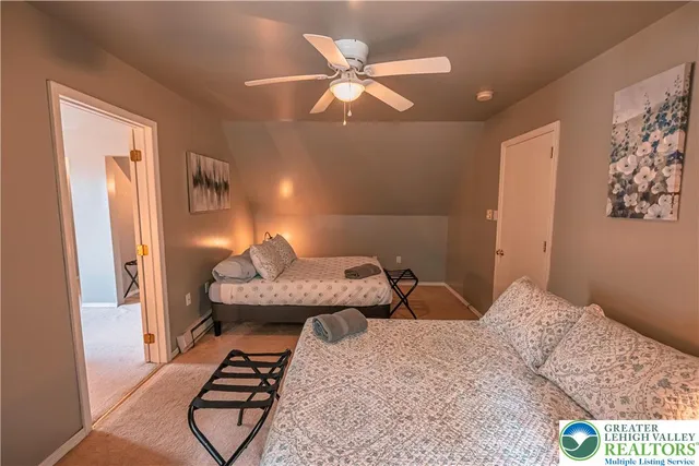 an aerial view of a house with a yard basket ball court and outdoor seating
