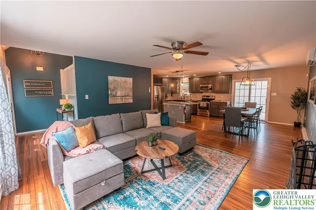 a living room with furniture and a rug