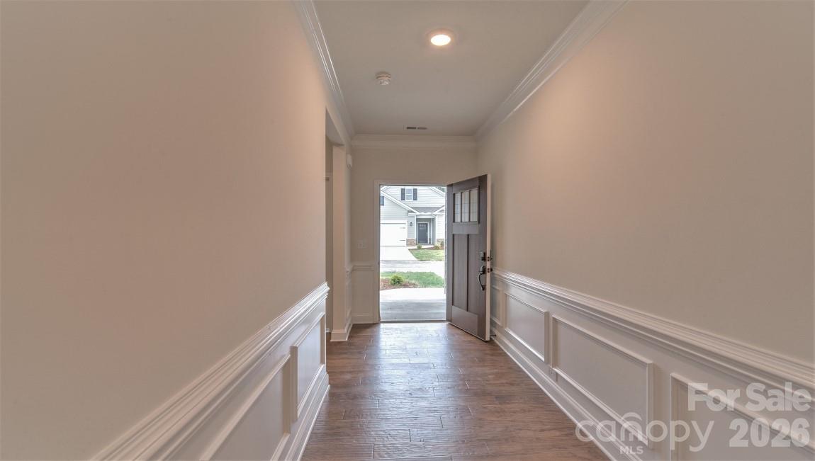 649 River Btm Road Fletcher, NC 28732 - Photo 6 of 40 a hallway with wooden floor and windows