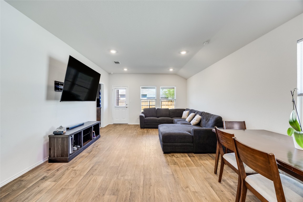 17409 Ginning Court Elgin, TX 78621 - Photo 6 of 13 a living room with furniture and a flat screen tv