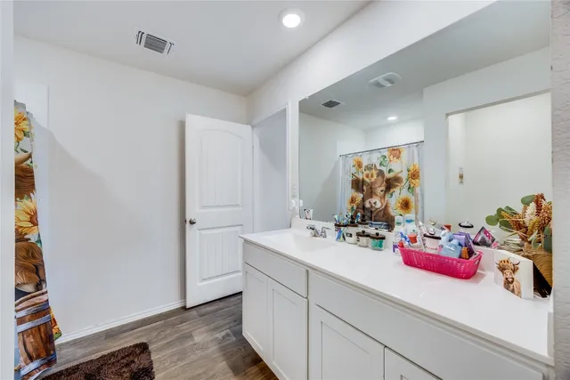 a bedroom with a bed and a fireplace