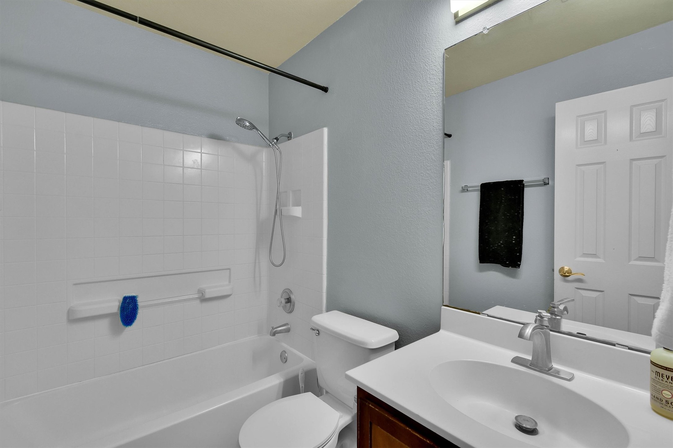 92 Verde Ranch Loop Leander, TX 78641 - Photo 13 of 37 Bathroom with vanity, shower combination, and a textured wall