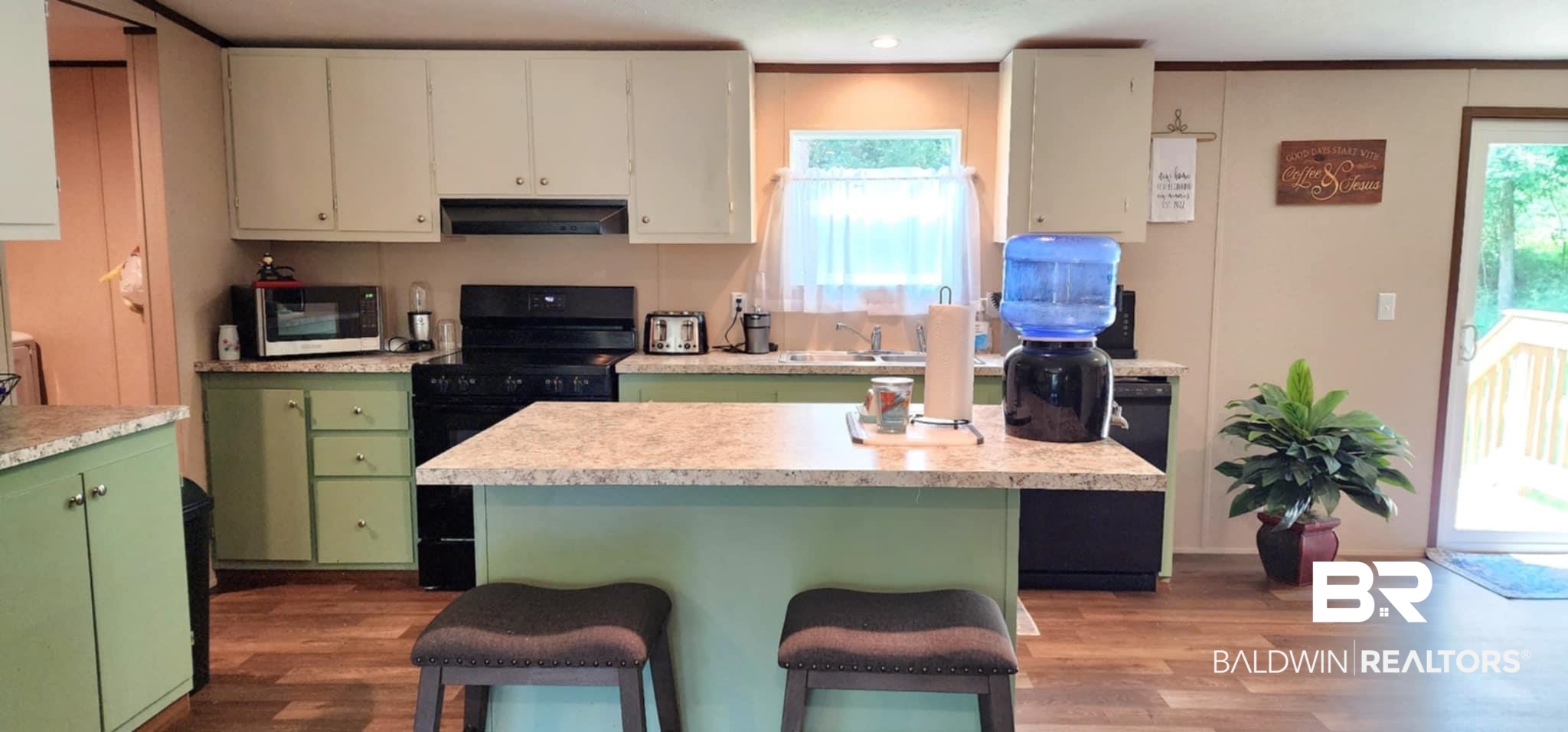 25474 Waterworld Road Robertsdale, AL 36567 - Photo 11 of 30 Kitchen with black range with electric stovetop, dark wood-style flooring, a center island, green cabinets, and light countertops
