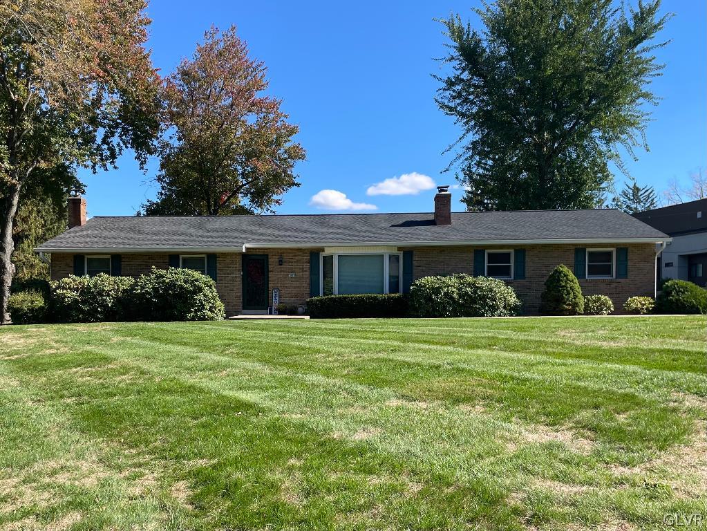 1909 Blue Barn Road Orefield, PA 18069 - Photo 1 of 39 a front view of a house with a garden
