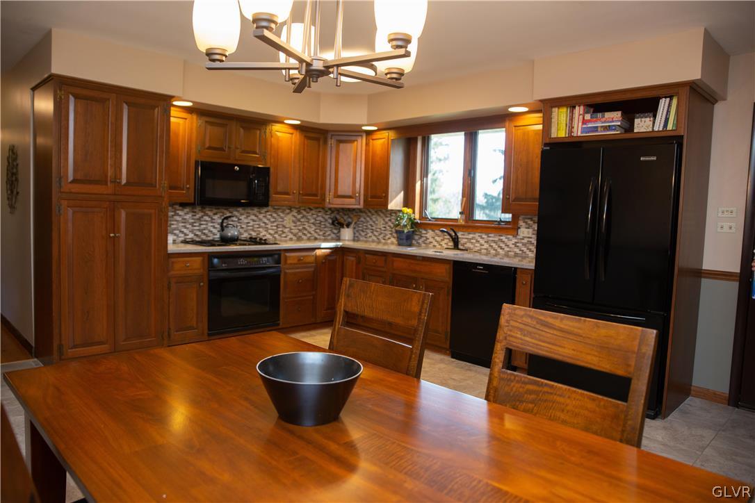1909 Blue Barn Road Orefield, PA 18069 - Photo 11 of 39 a large kitchen with a table and chairs