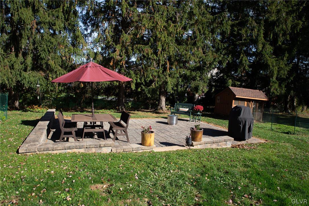 1909 Blue Barn Road Orefield, PA 18069 - Photo 29 of 39 a view of a table and chairs under an umbrella