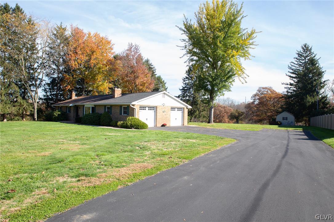 1909 Blue Barn Road Orefield, PA 18069 - Photo 3 of 39 a front view of house with yard and trees in the background