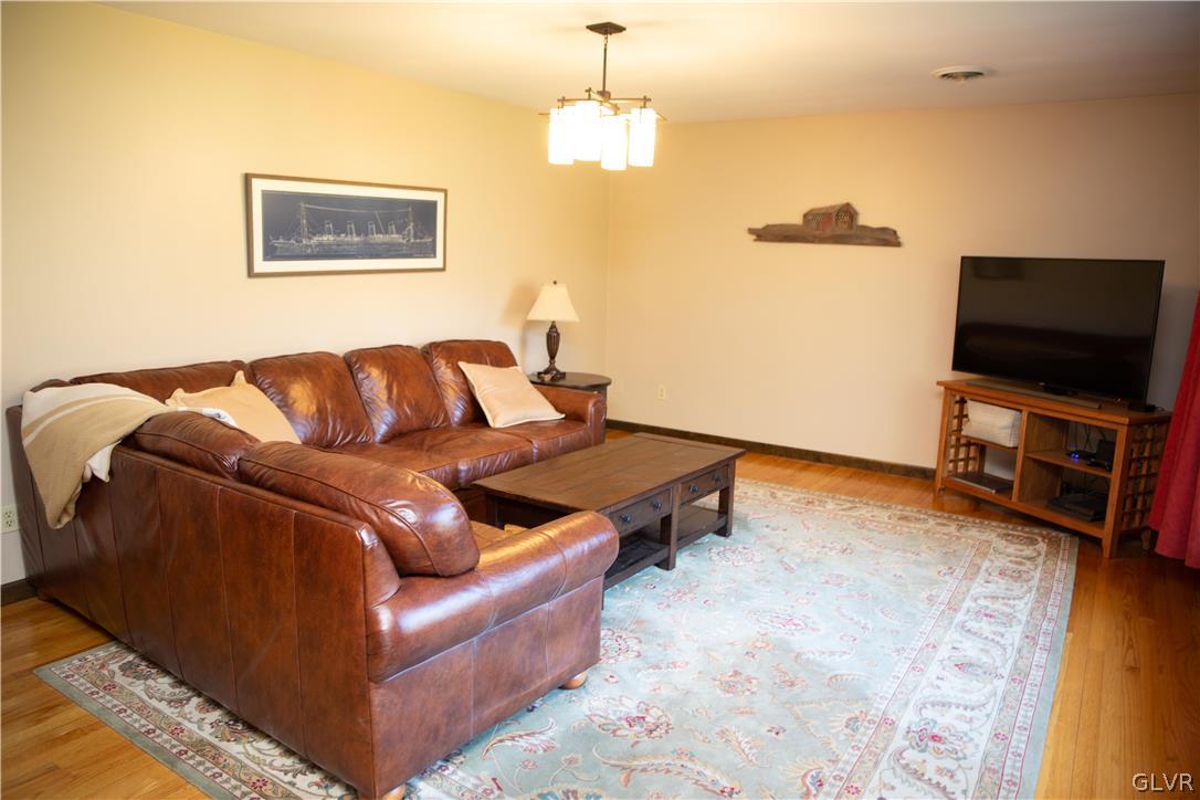 1909 Blue Barn Road Orefield, PA 18069 - Photo 6 of 39 a living room with furniture and a flat screen tv