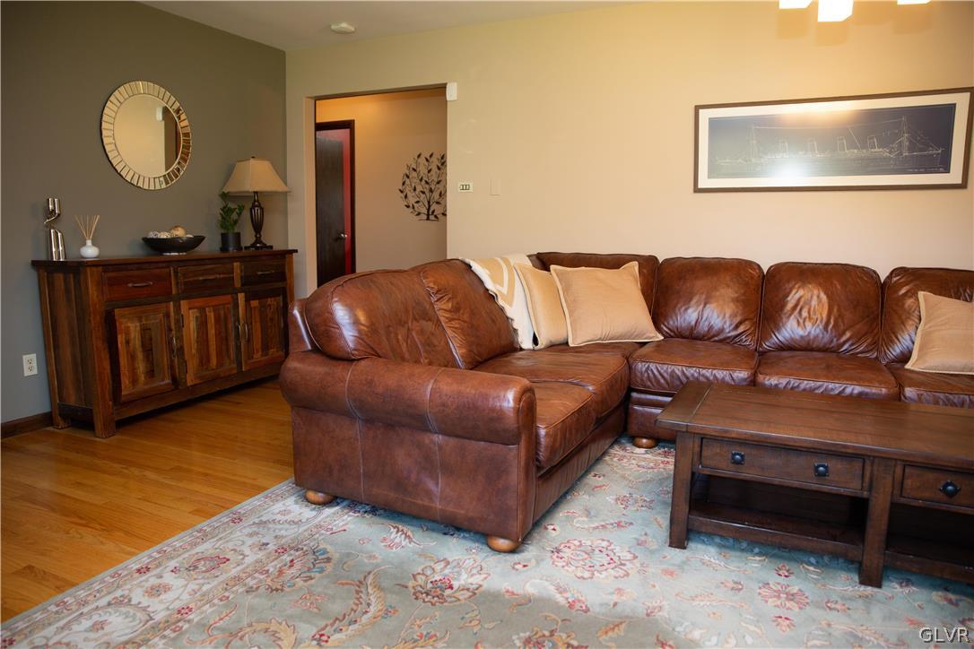 1909 Blue Barn Road Orefield, PA 18069 - Photo 8 of 39 a living room with couches a mirror and dresser