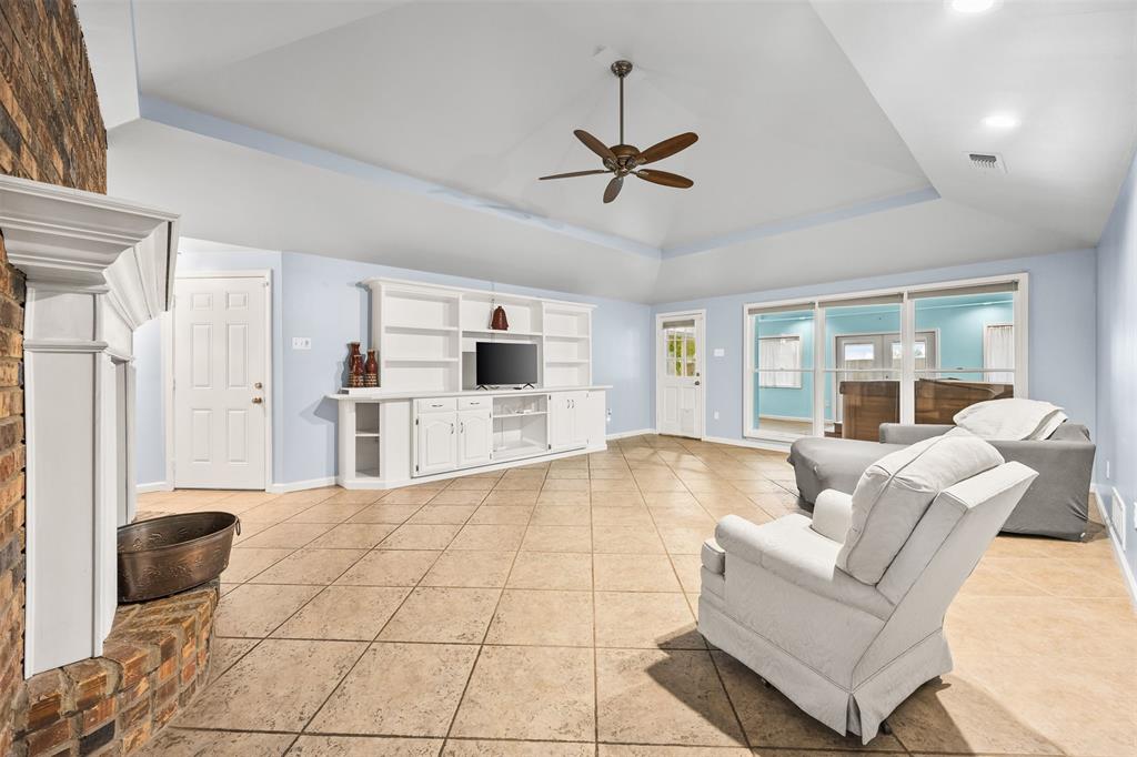 909 Valley View Avenue Red Oak, TX 75154 - Photo 17 of 37 a living room with couches and kitchen view with wooden floor