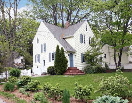 67 Middlesex Road Darien, CT 06820 - Photo 1 of 8 a front view of a house with a yard and trees