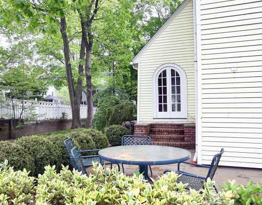 67 Middlesex Road Darien, CT 06820 - Photo 2 of 8 a view of a backyard with plants and a patio