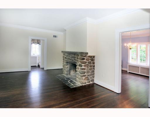 67 Middlesex Road Darien, CT 06820 - Photo 3 of 8 a view of empty room with window and wooden floor